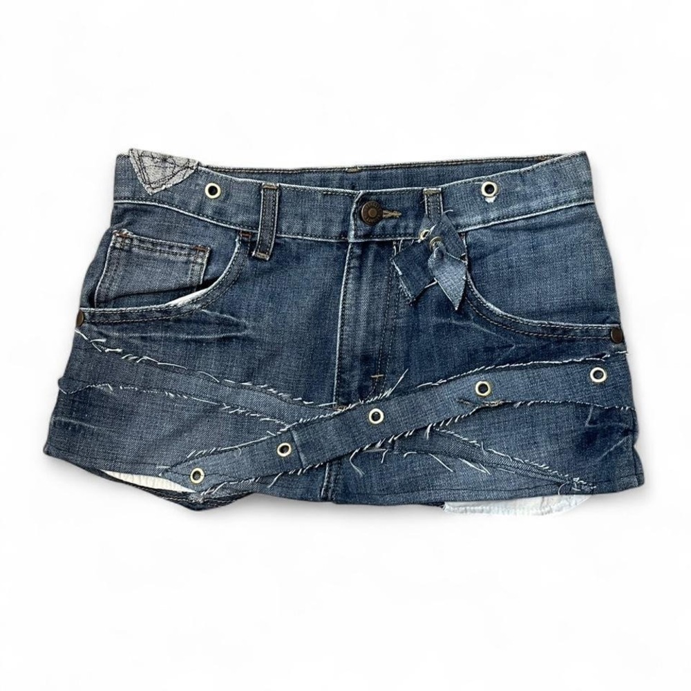 upcycled low rise denim mini skirt with unique stitching and eyelets